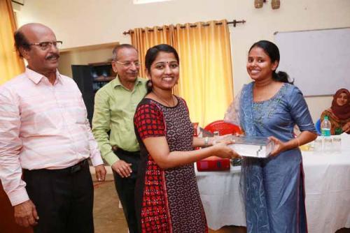  Arundathi Dileep presents Law Lexicon (Vol II) to the First Rank holder Angel