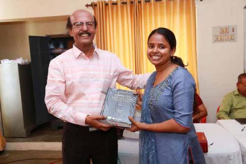  Dr CRK Nair presents Law Lexican (Vol IV) to Angel