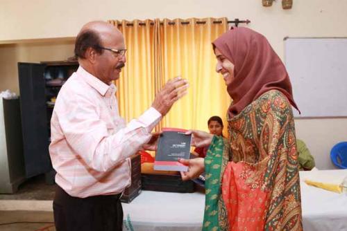  Dr CRK Nair presents Law Dictionary to the Twentieth rank holder, Sithara Shamsudeen