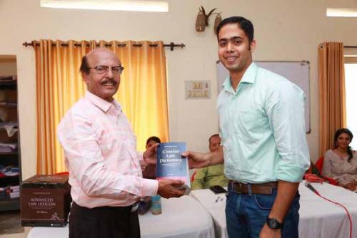  Dr CRK Nair presents Law Dictionary to the Second rank holder (NCA), Anand Parathara