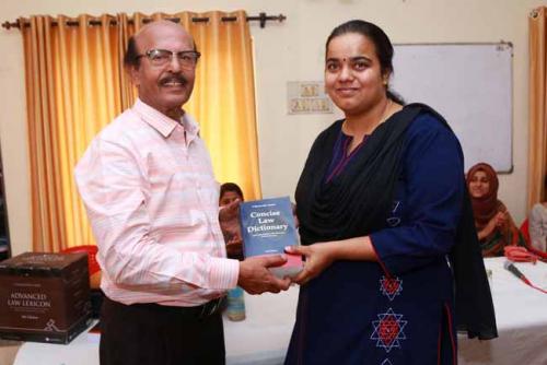  Dr CRK Nair presents Law Dictionary to Mrs Rajeswari J