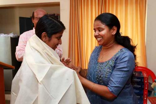 First rank holder Angel Rose Jose honours last year's first rank holder Mrs. Arundathi Dileep