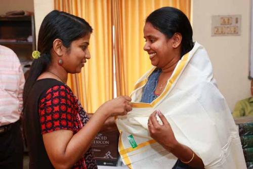 Last year's first rank holder Ms. Arundathi Dileep honours this year's First rank holder Angel  Rose Jose