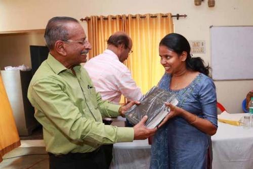 Justice M R Hariharan Nair presenting Law Lexicon (Vol I) to the First rank holder Angel Jose Rose